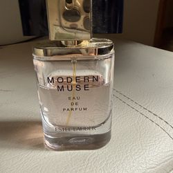 Selling this Modern Muse Eau De Parfum Estee Lauder perfume  Still a lot left as seen in the pictures