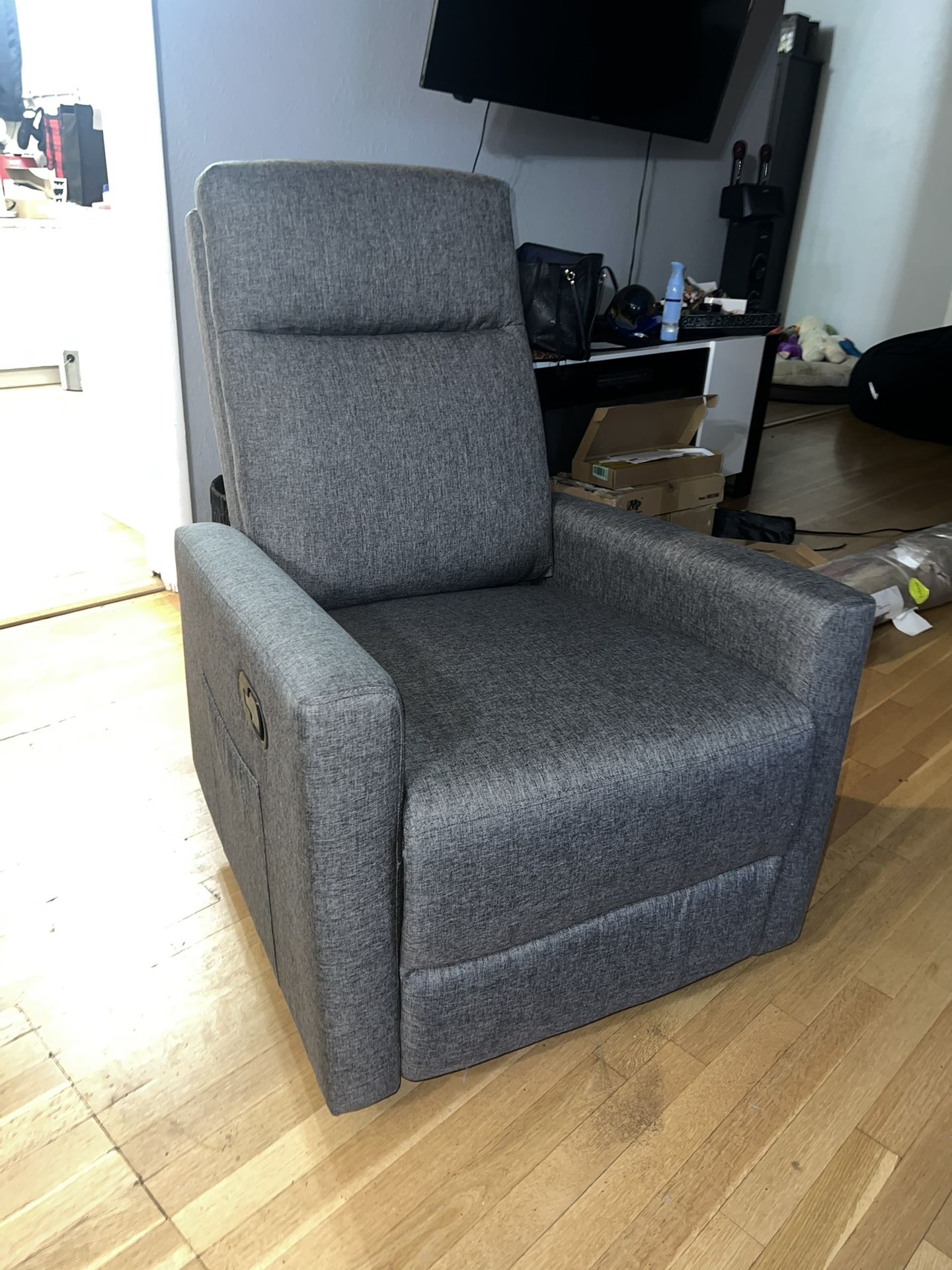 Grey swivel rocking recliner chair. Brand new