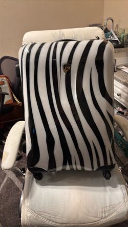 Used zebra print luggage
