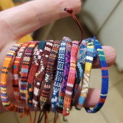 12 PIECE BRAIDED BRACELET SET  NEW IN PLASTIC FREE SHIPPING