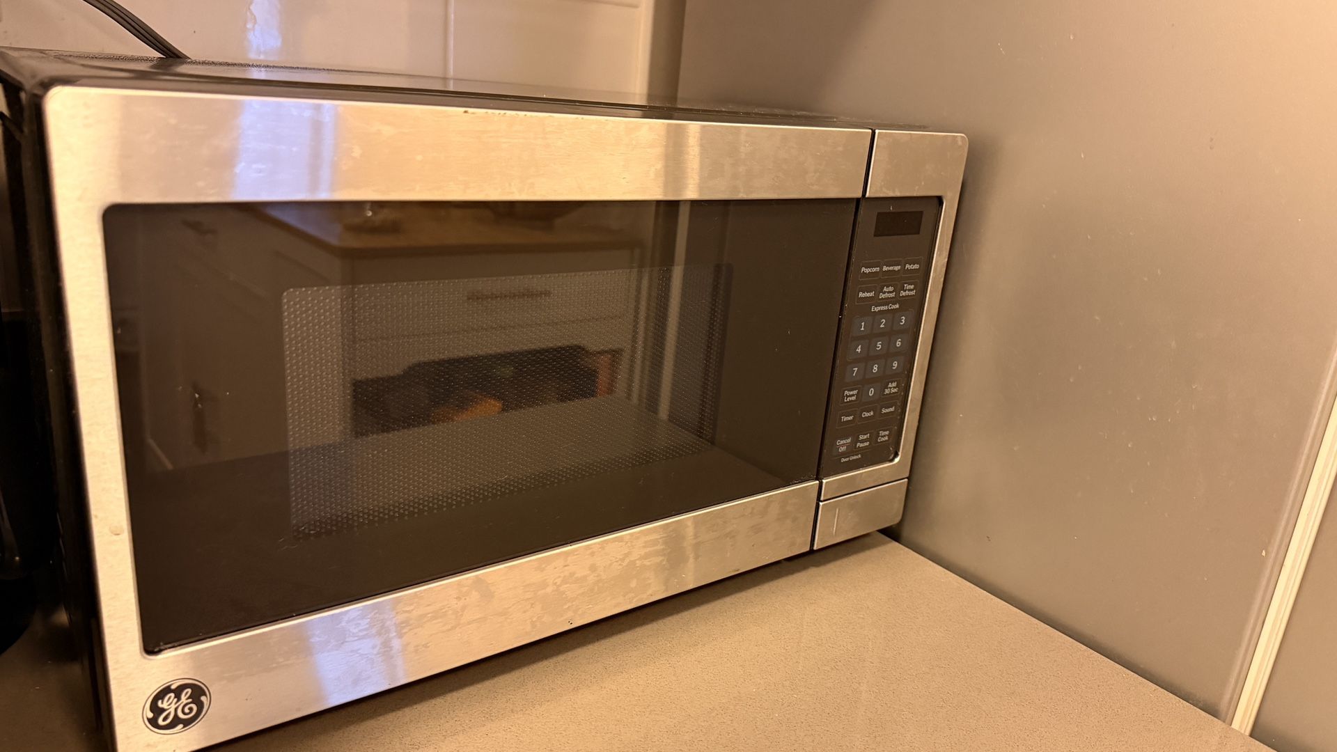 GE Countertop Microwave (Like new) recently purchased, moving and no longer need