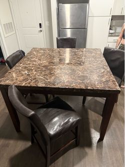 Dining room table including 4 chairs