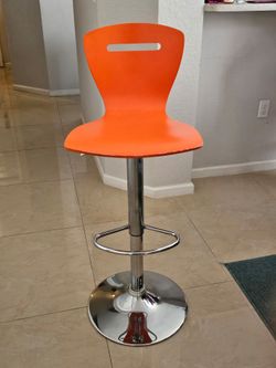 4 orange counter chairs