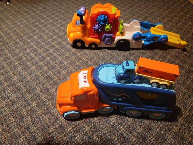 2 Large Semi Trucks That Carry Other Vehicles