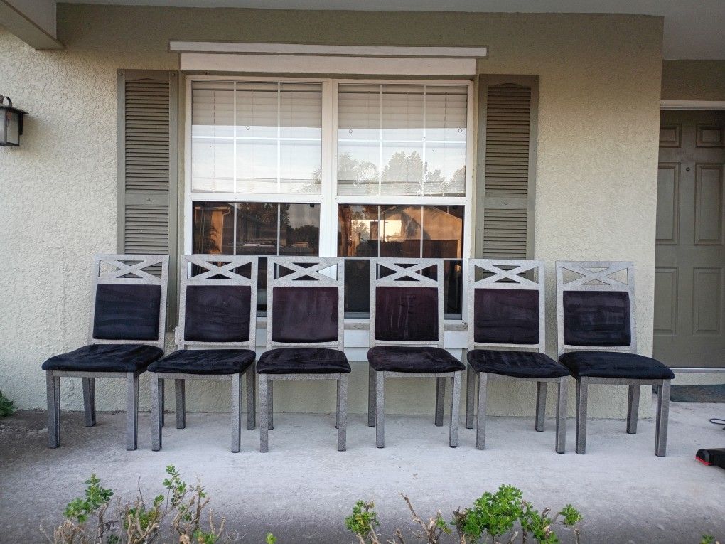 Seven Black Metal Chairs