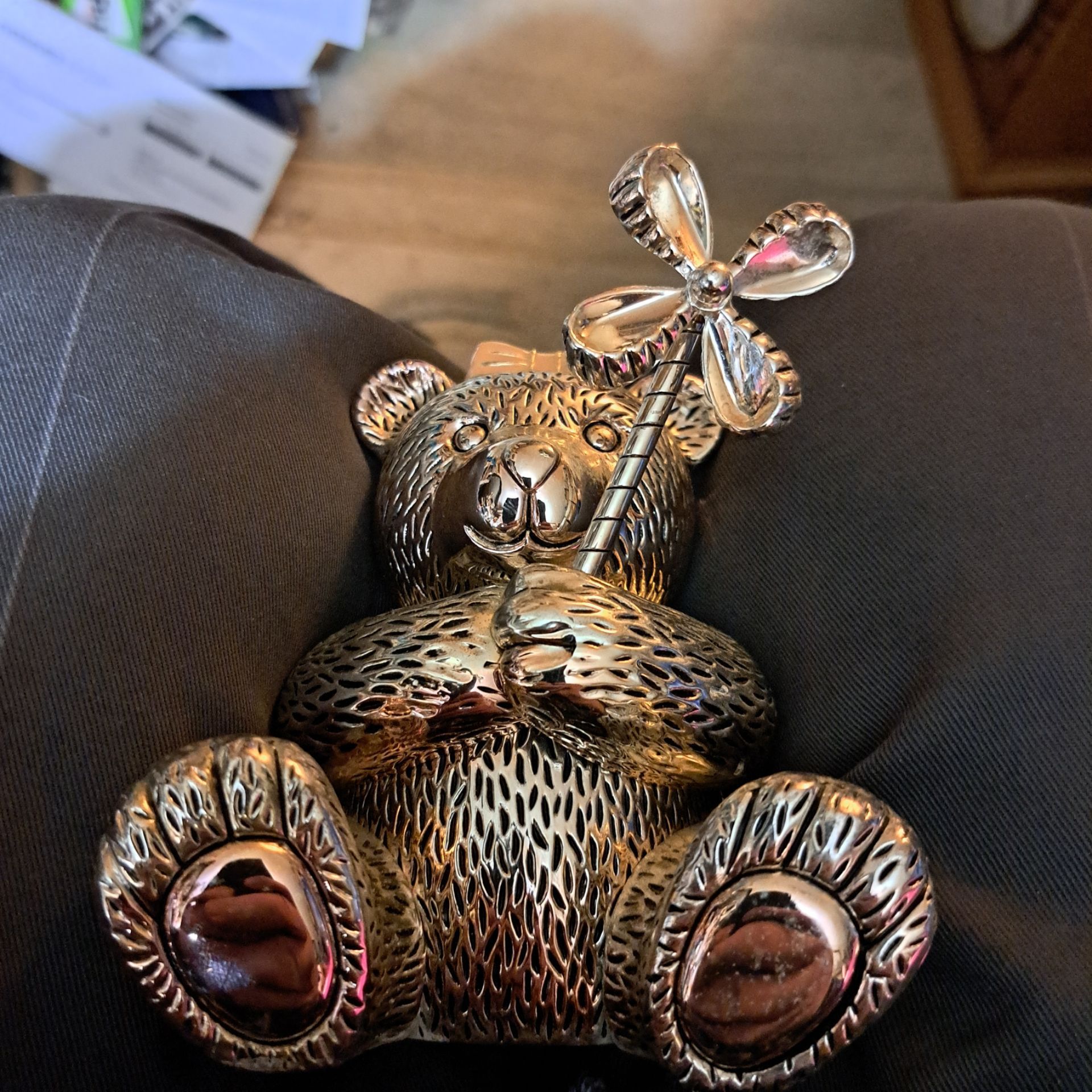 This is a silver-plated teddy bear piggy bank by Reed & Barton. See last picture for msrp