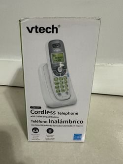 The VTech Cordless Phone with Caller ID & Call Waiting CS6114 is a sleek white handset that offers convenience and functionality. With its cordless de