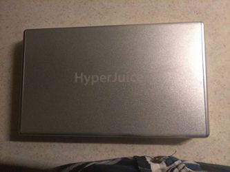 Hyperjuice portable Macbook and dual 12 Watt USB charger with charging cord for unit.