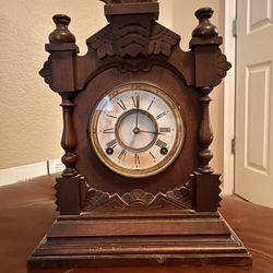 1878 Antique Ansonia mantel mechanical clock in oak cabinet