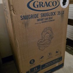Brand New - Graco SnugRide SnugLock LX Car Seat featuring TrueShield Technology