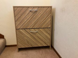 Wooden shoe cabinet with chevron design