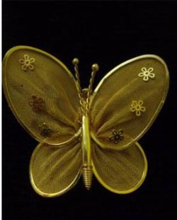 Gold tone mesh butterfly pin