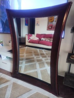 Curved hanging mirror