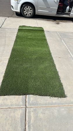 Fake grass rug 3 1/2 feet wide by 10 feet long