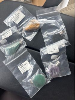 Lot of 29 crystal necklace pendants.