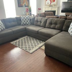 Very nice three-piece grey Ashley furniture sectional