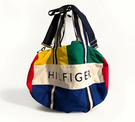 vintage Tommy Hilfiger multicolor colorblock canvas duffle bag featuring a bold "HILFIGER