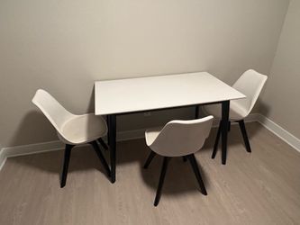 White dining table with four chairs