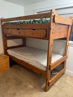 “Built tougher than a ‘back in my day’ story. Vintage solid wood bunk bed.”