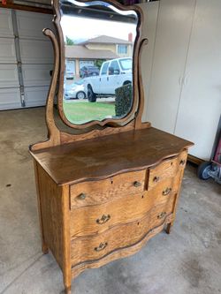 Antique Oak Dresser with removable beveled mirror.