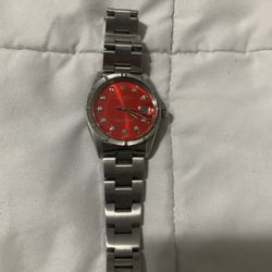 Authentic Rolex Stainless Steel Date Model. Full-size Bracelet . Oyster Perpetual. Red Diamond Dial . Read Ad. Firm Price 