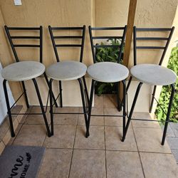 4 Bar Stools for $40. 30" High.  Metal Legs. Upholstered seats.