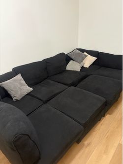 Family size black couch comes with pillows
