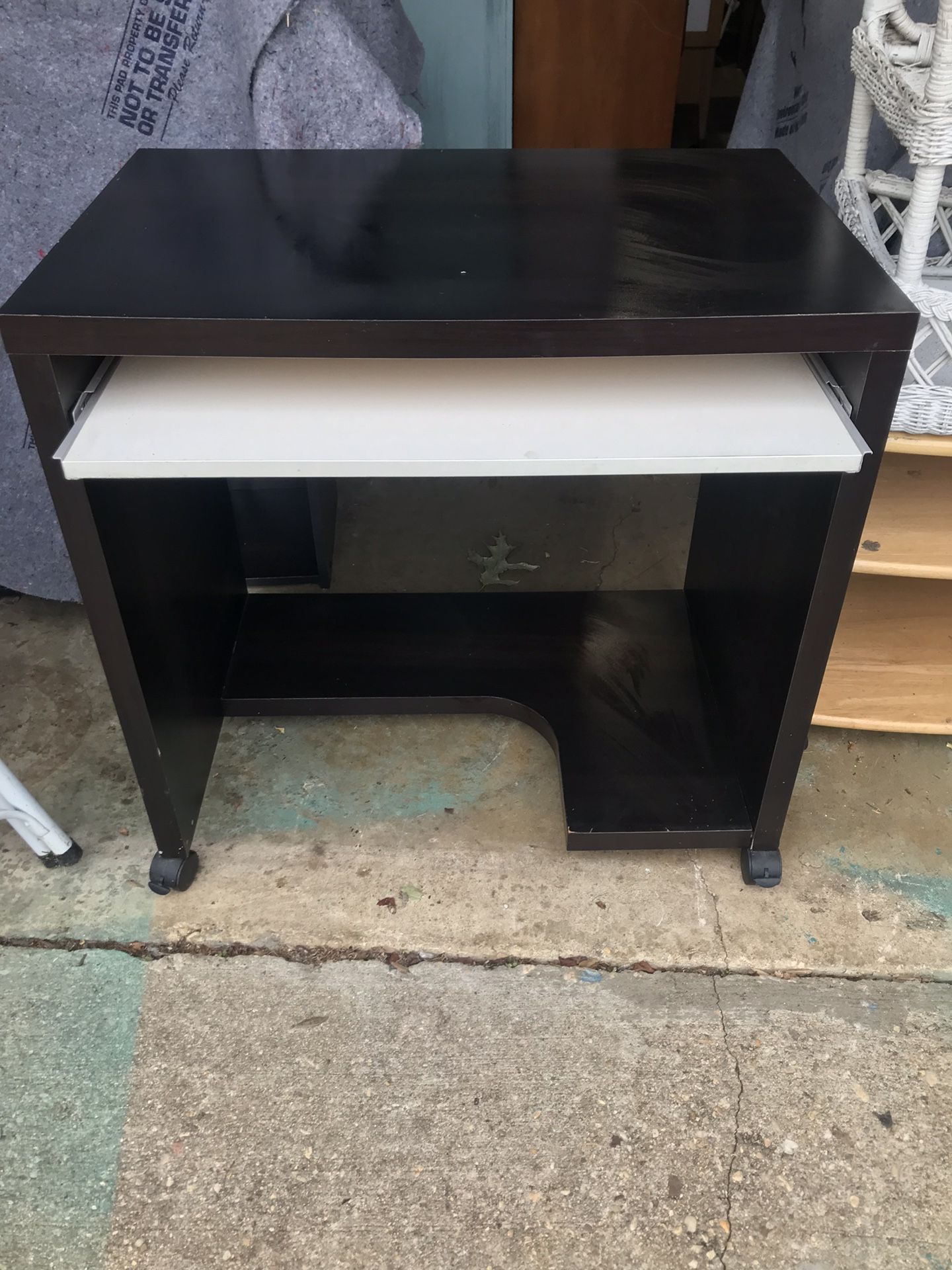 Small Black Rolling Desk with white pull out.