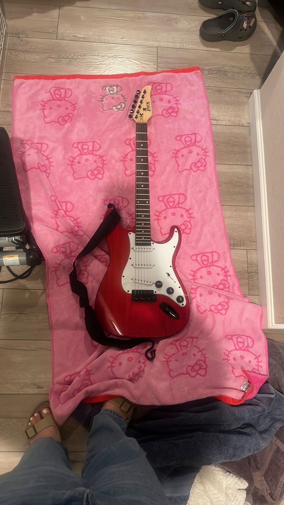 Red Electric Guitar With Black straps and Amp