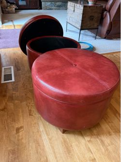 Two Leather Storage Ottomans.