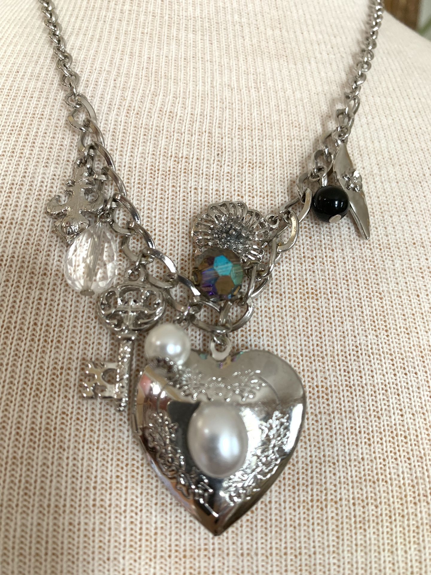 Silver tone heart locket necklace