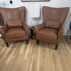 Two High Back Arhaus Leather Chairs 