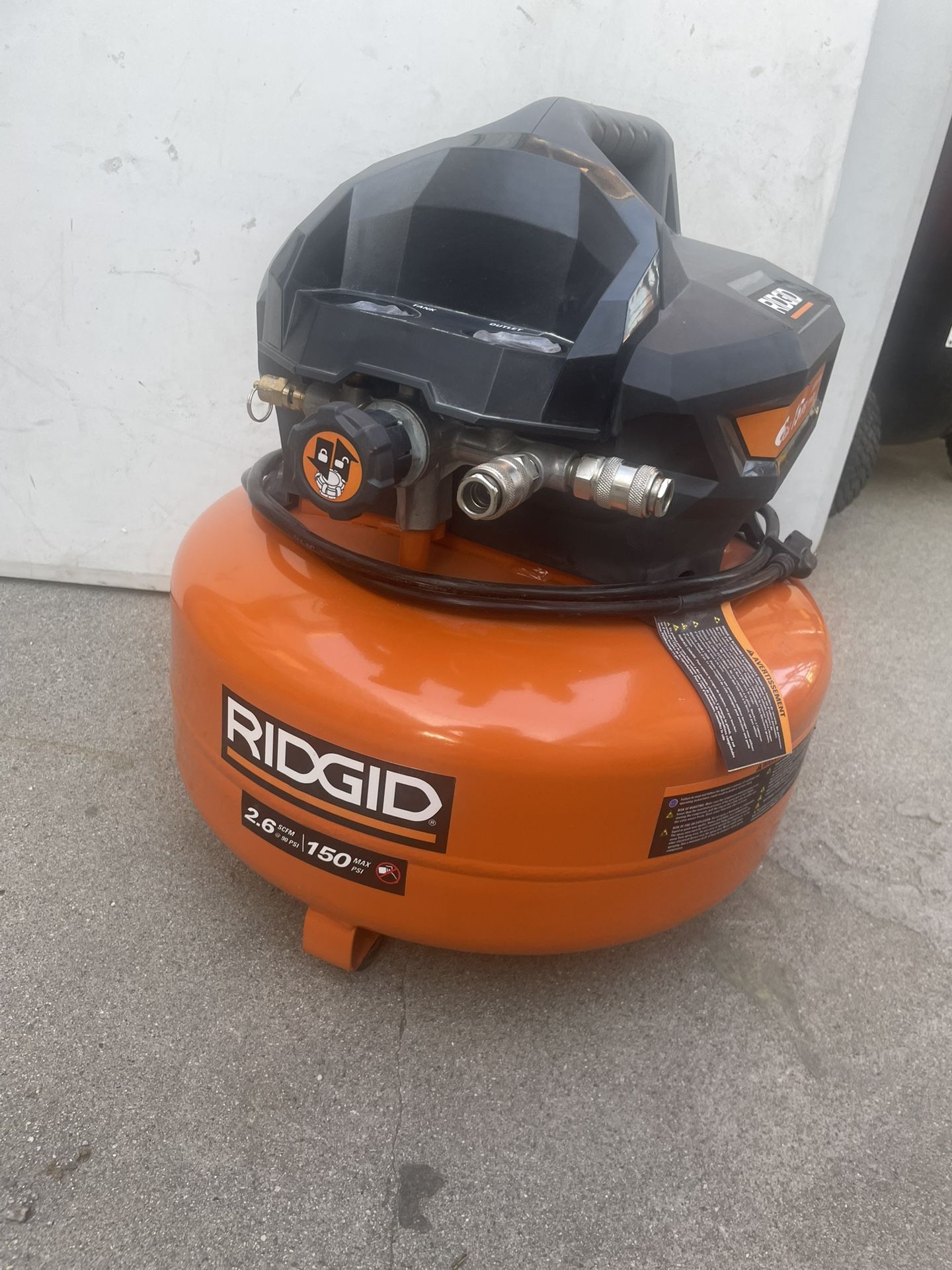 RIDGID 6 Gal. 150 PSI Portable Electric Oil-Free Jobsite Pancake Air Compressor with Dual Pressure Gauges and 2-Quick Couplers