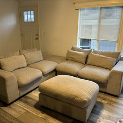 Grey Couch with two ottoman’s 