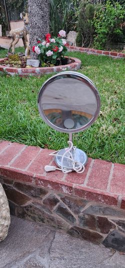 Make up mirror with magnifier and plugs in  Light