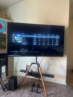 Large Flat Screen TV on Floor Stand