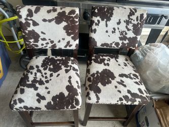 Cow print tall chairs
