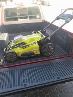 Like new Ryobi battery powered lawn mower