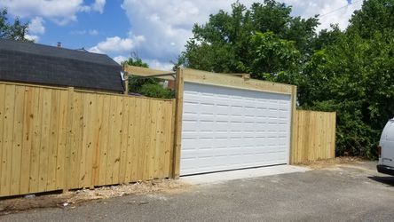 Garage doors and fence.