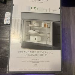 Under sink storage shelf