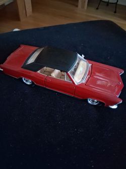 Red and Black Maisto 1965 Buick Riviera Grand Sport Die Cast Model Car