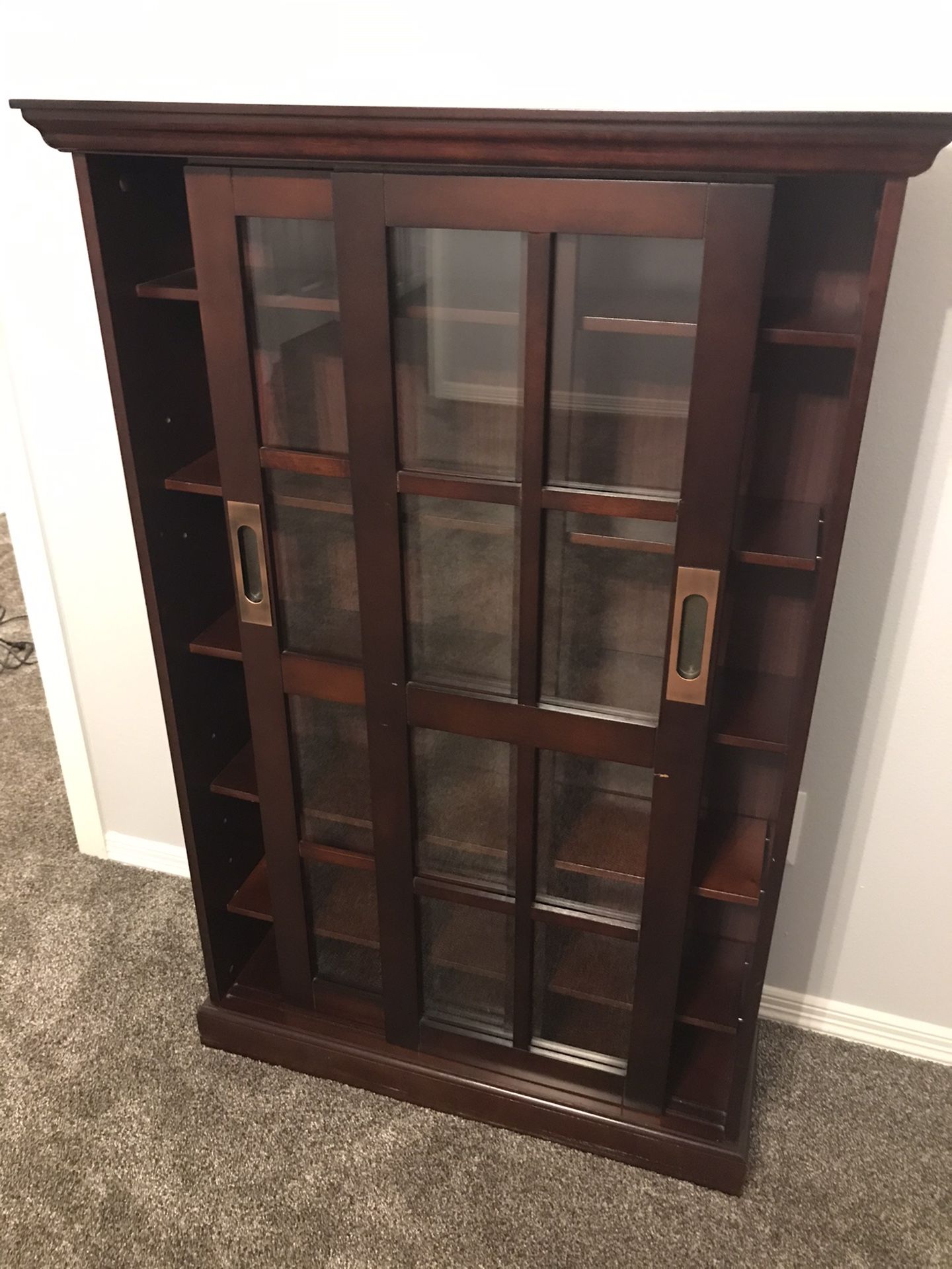 DVD Case and/or Bookshelf! Gently used with glass doors and adjustable/removable shelves