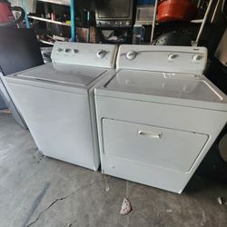 Pair of washing machines are Kenmore brand gas