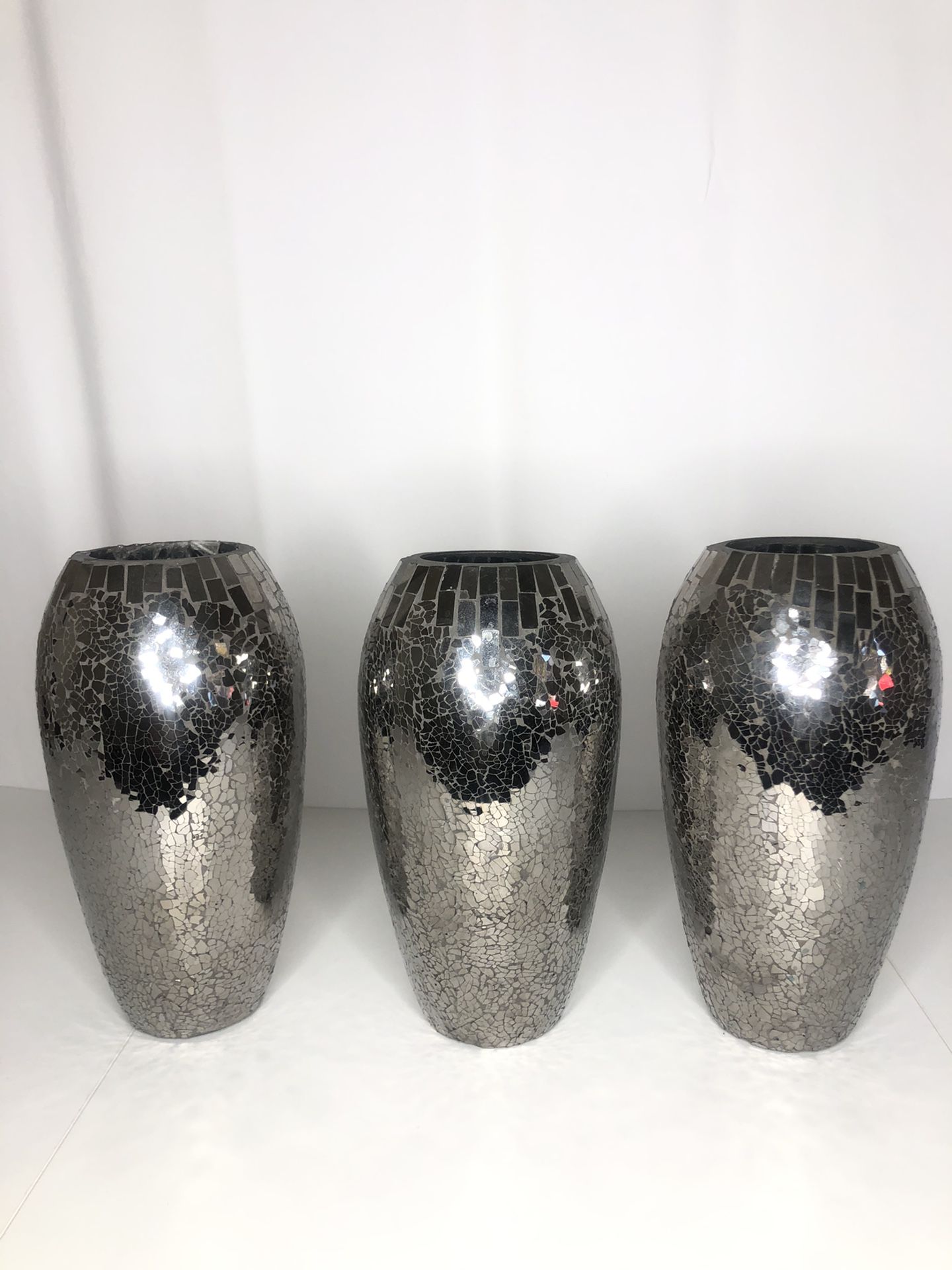 3-12inch tall vases with mirrored glass on outside. All in great condition.