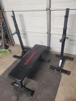 Flat Weight Bench With Adjustable Squat Rack With Spotters..used but still works good..