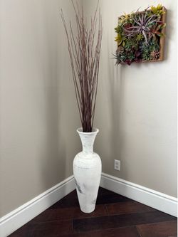 Tall floor vase with wood branches