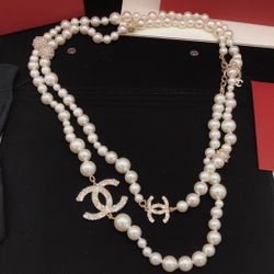 50” Stunning Pearl and Signature double C Chanel Necklace