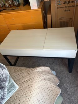 Coffee table with lift top
