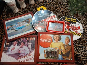 Coca-Cola signs and framed art