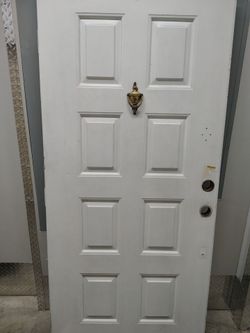 White 6-Panel Exterior Door with Brass Knocker